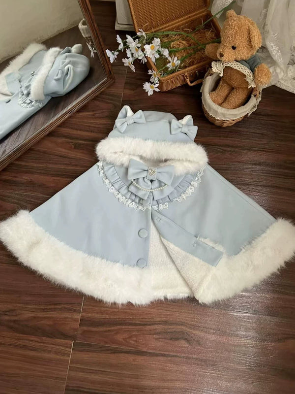 White cat-ear cape with plush trim at the hood, cuffs and hem, styled over a red-and-white Lolita dress.