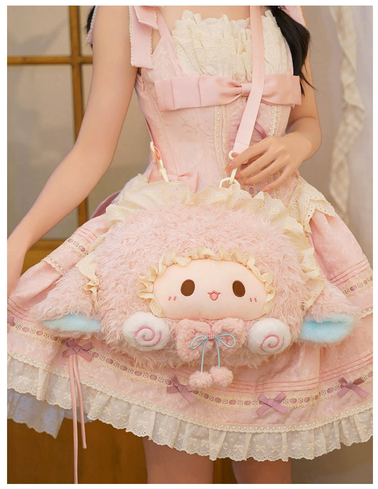 Pink fuzzy sheep-character bag with a rounded face, lace edging, and ribbon straps.