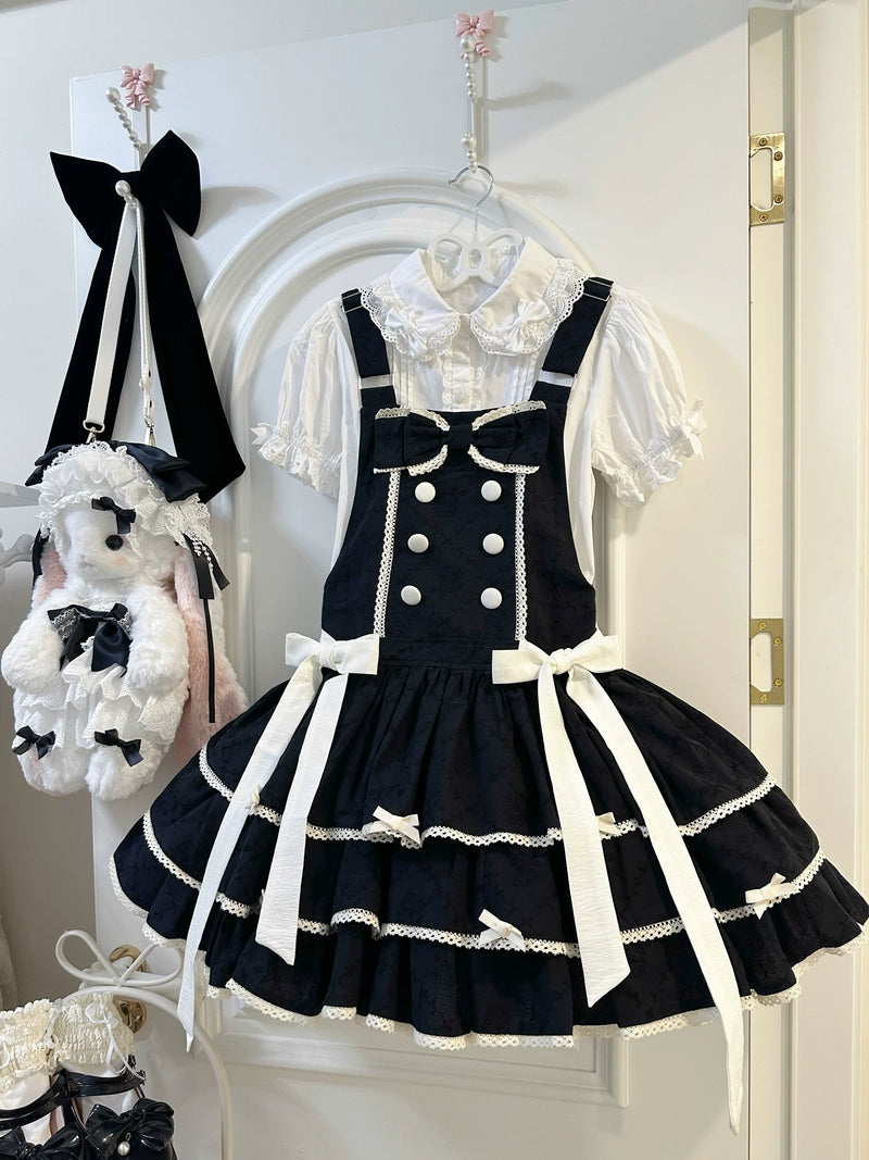 Three-tier cotton lolita jumper dress with wide suspender straps and ribbon waist sashes