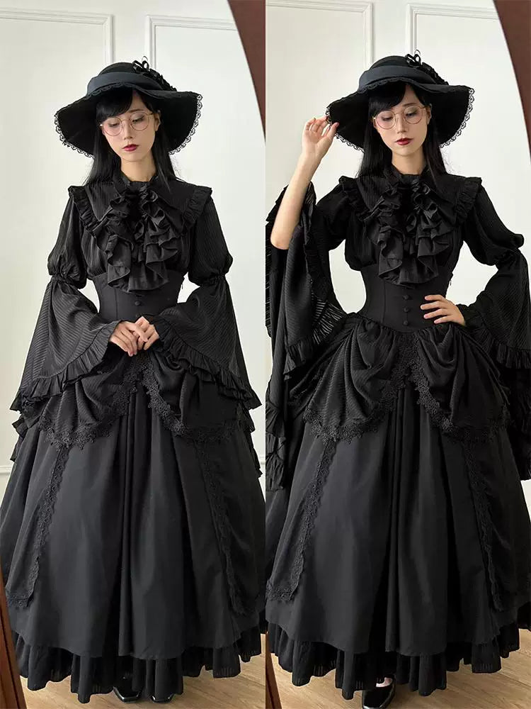 Black hime-sleeve blouse and half-skirt set with ruffles and lace panels in a mirror.