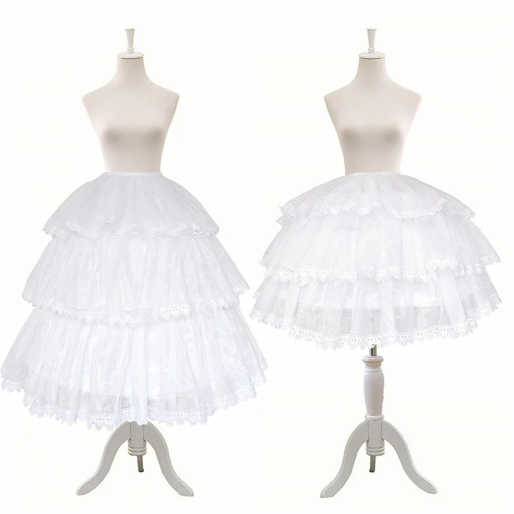 White tiered Lolita hoop petticoat displayed on dress forms.