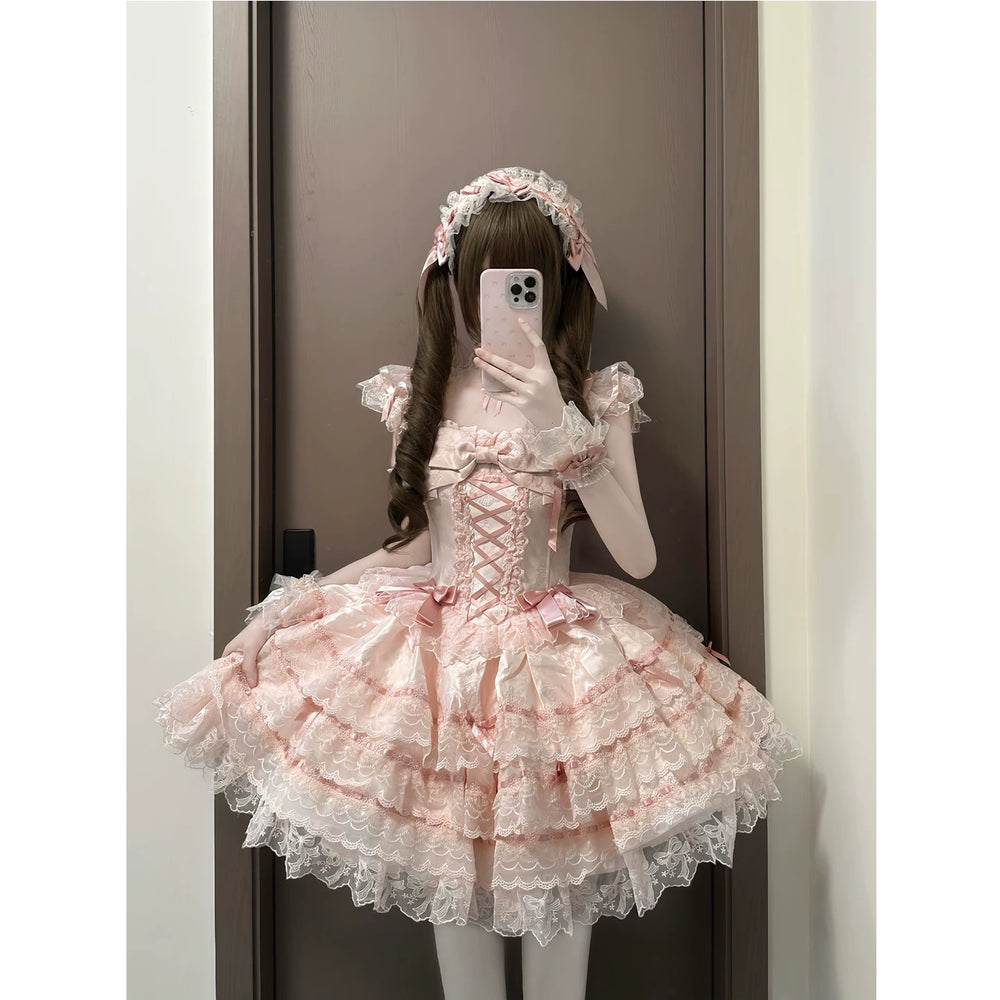 Creamy pink Lolita dress with layered lace skirt, bows and matching accessories