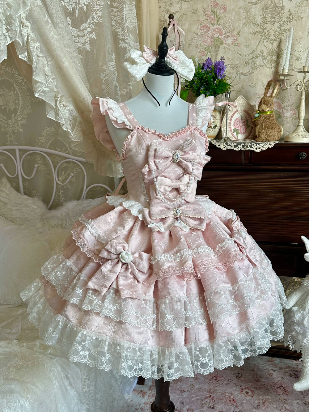 Pale blue Sweet Lolita OP dress with jacquard fabric, tiered skirt, and bow accents