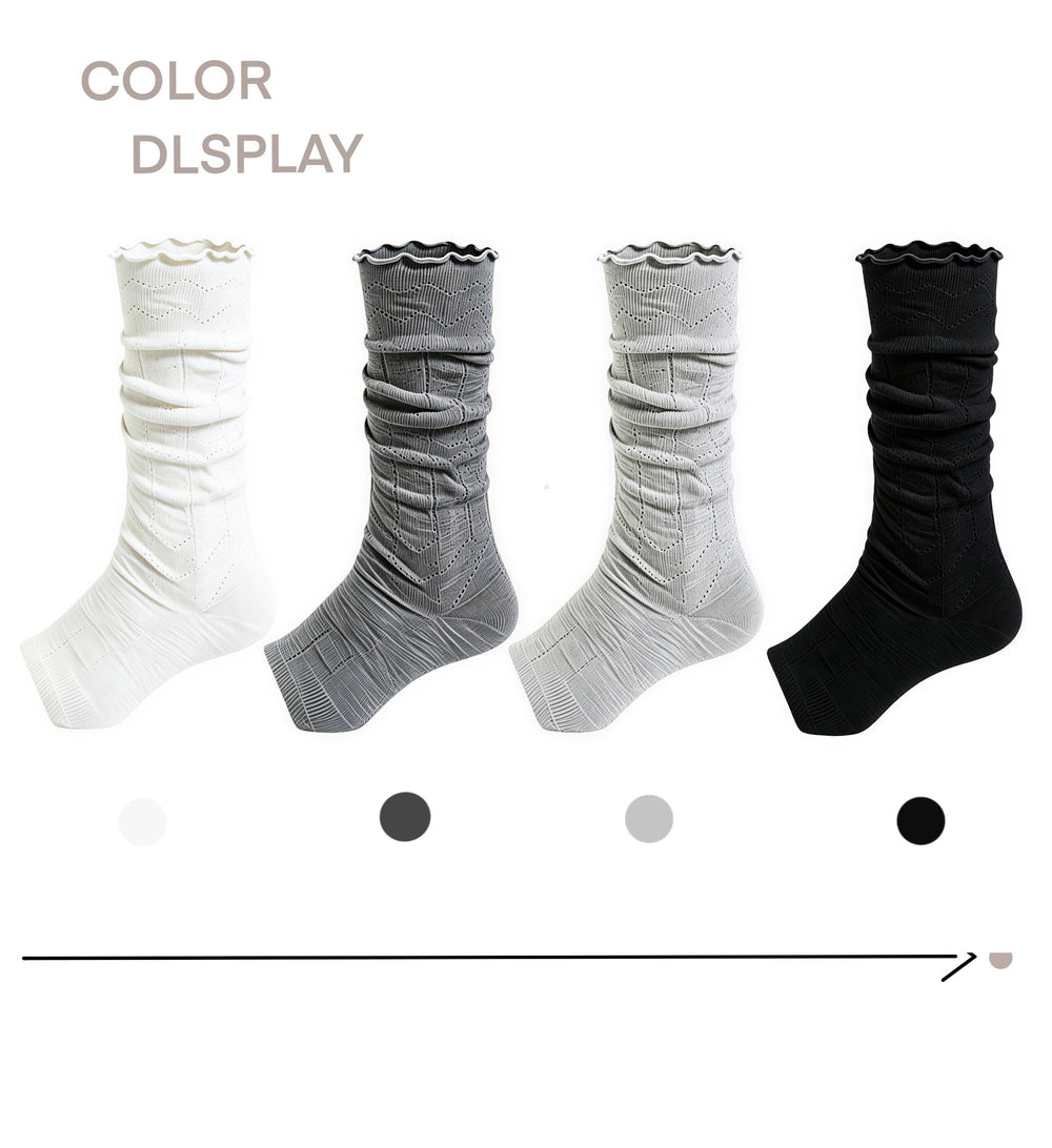 Mesh slouch stirrup socks in white, grey and black with ruffled edges.