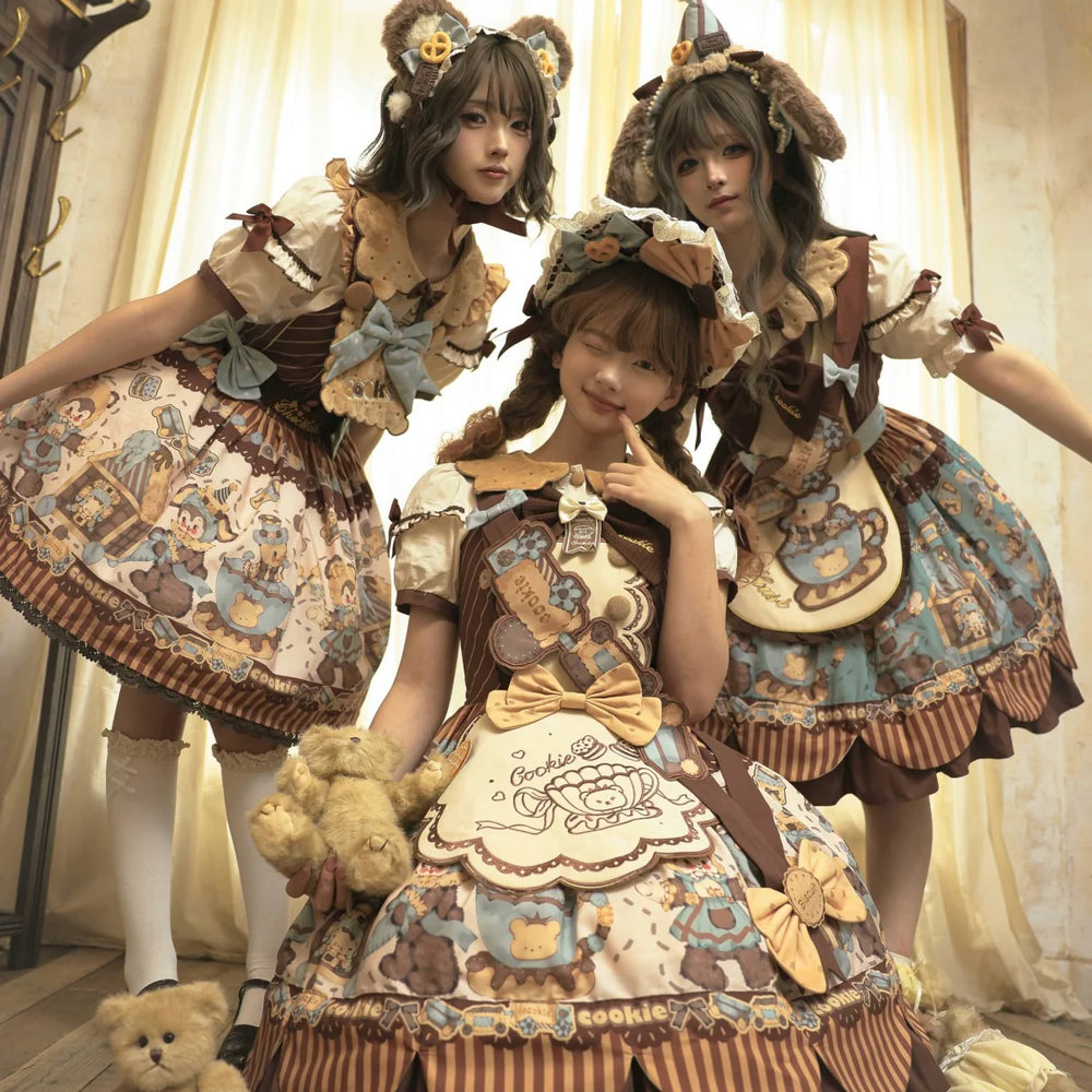 Three models wearing bear-cookie printed beige and mint Lolita dress sets