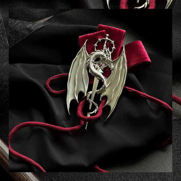 tonight Gothic dragon accessory with winged motif, red ribbon and silver-toned hardware
