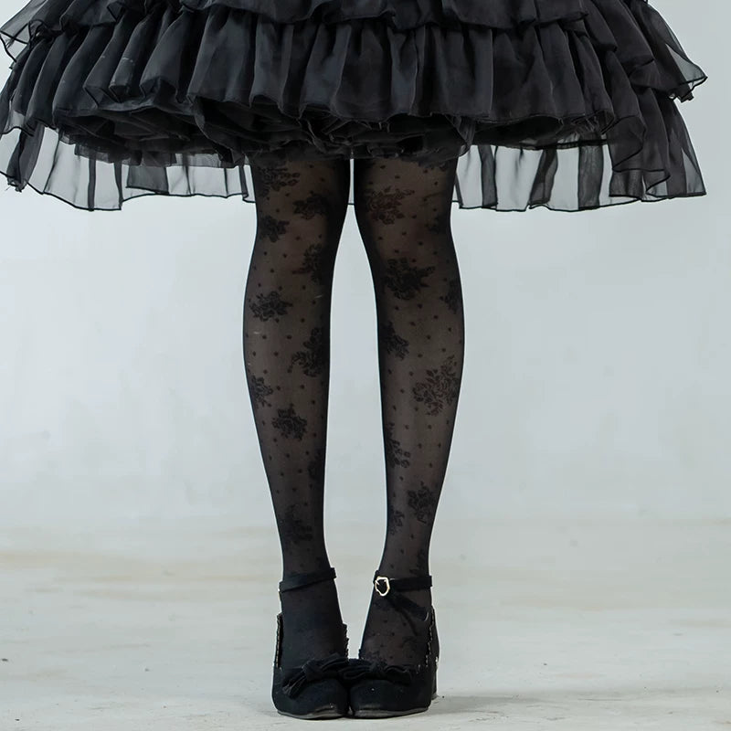 White and black rose-patterned pantyhose styled with Lolita skirts.