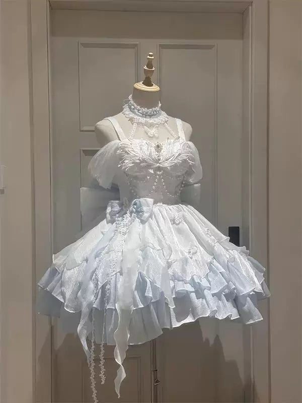 White-and-blue butterfly Lolita dress with a large back bow displayed on a mannequin