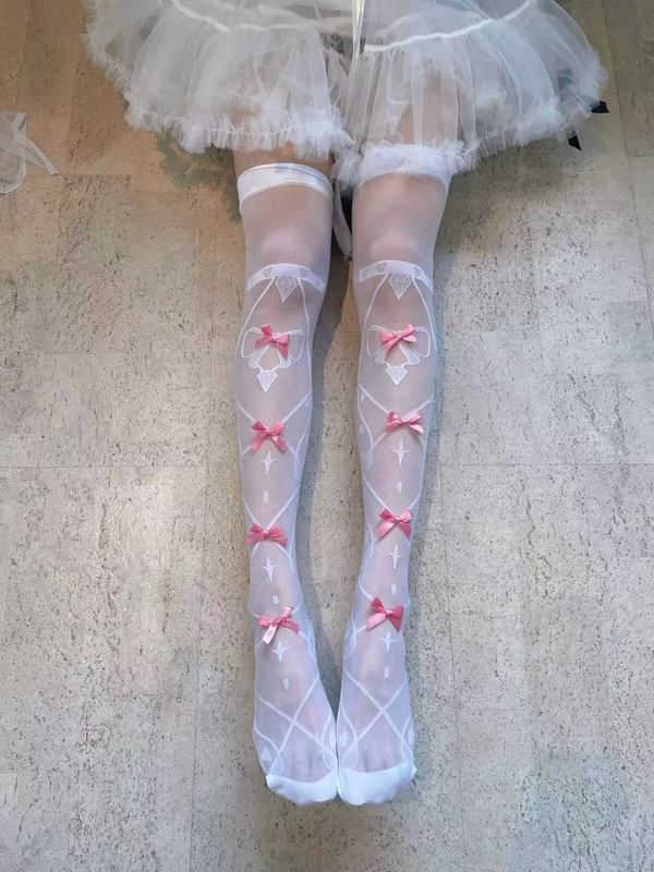 Fantasy Doll white over-the-knee socks with blue bows and diamond motifs styled with black Mary Jane shoes.
