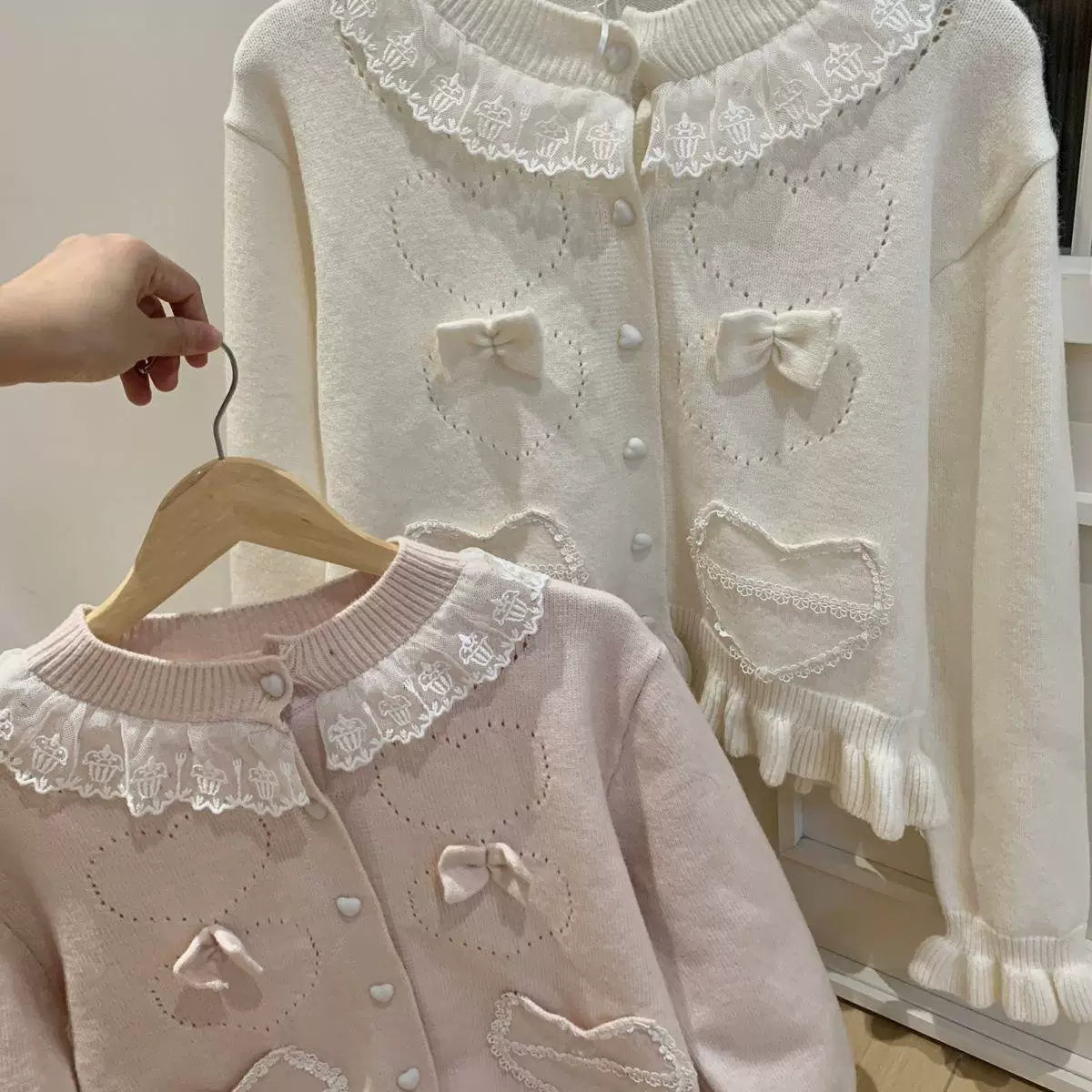Off-white butterfly knot lace trim cropped lolita cardigan with bow accents and button front