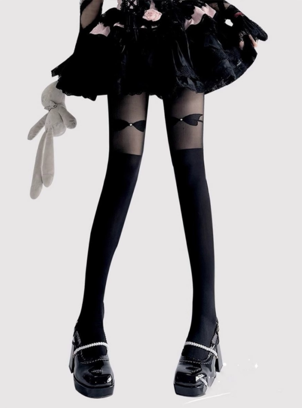 White over-the-knee stockings with sheer bow panels and pink Mary Jane shoes