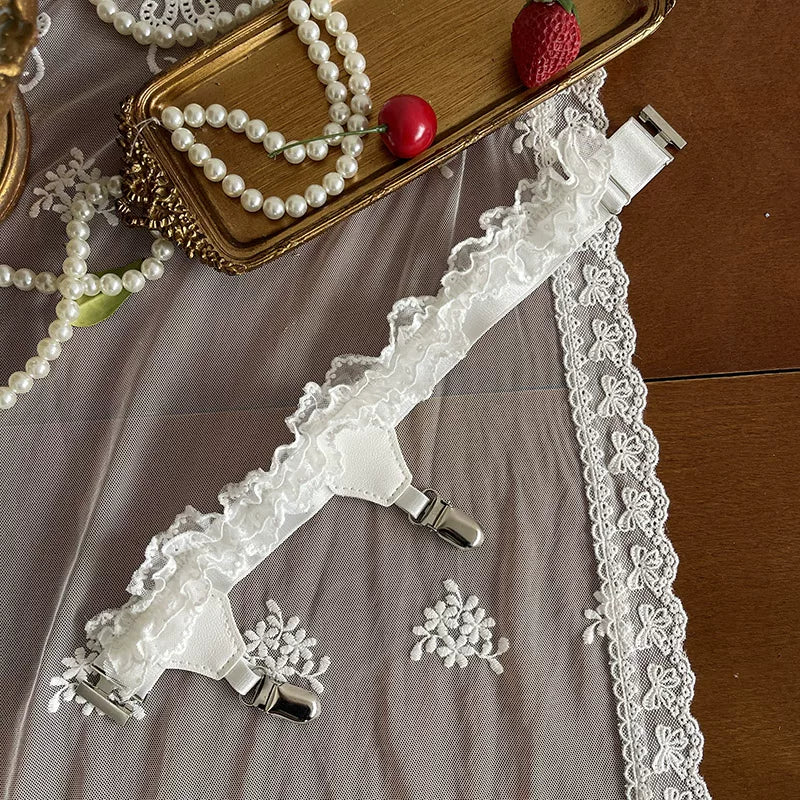 White lace legwear layering pieces with clips and ruffle trim