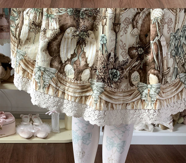Printed tights with heart-lock motifs and bow accents arranged in ecru, pink, blue and green variants