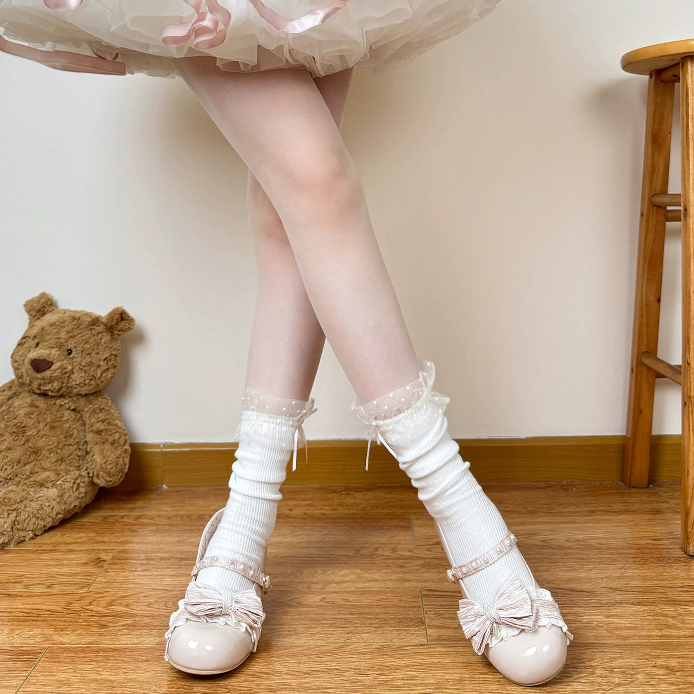 White mid-calf Lolita socks with lace trim, gathered texture and bow detail