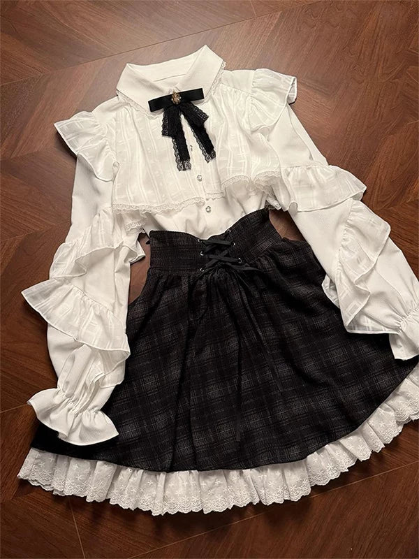 Black-and-white long-sleeve blouse and high-waisted skirt set with lace trim
