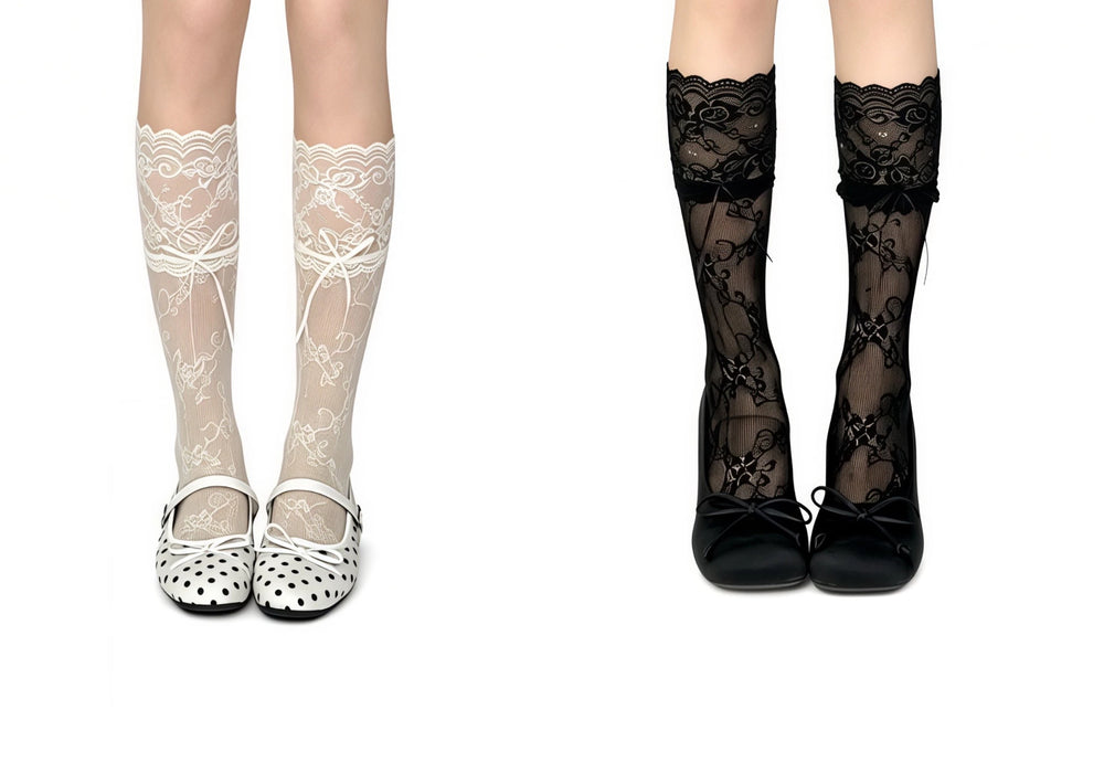White and black lace mid-calf socks with bow details styled with rounded Mary Jane shoes.