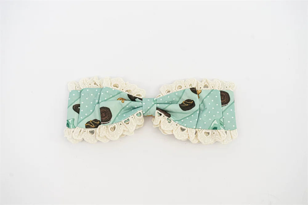 Pumpkin Planet mint-green polka-dot bow accessory with lace edging