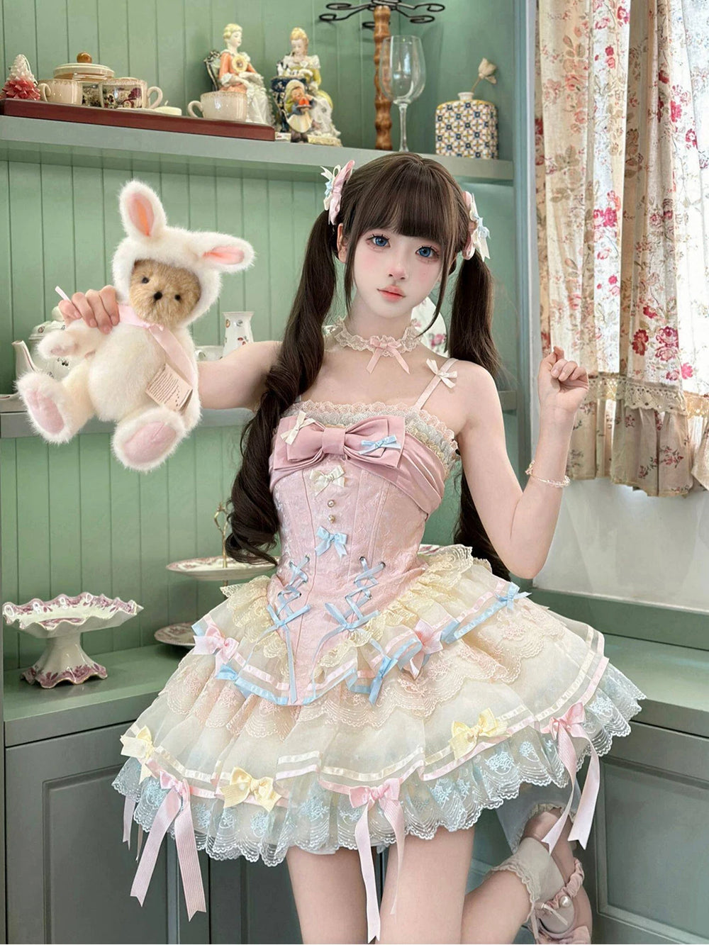 Model wearing a Creamy pastel pink-and-blue JSK dress with ribbon trim and trailing hem