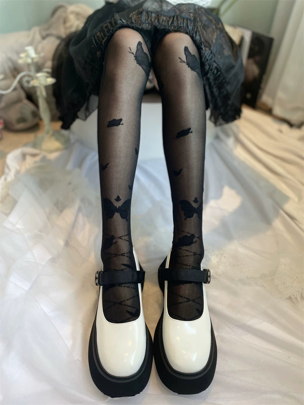 Fantasy Doll Nirvana Butterfly over-the-knee socks shown in black and white with butterfly motifs.