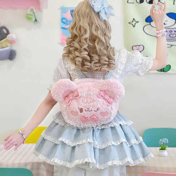 Pink plush bear Lolita backpack with lace edging and bows shown from the front and back.