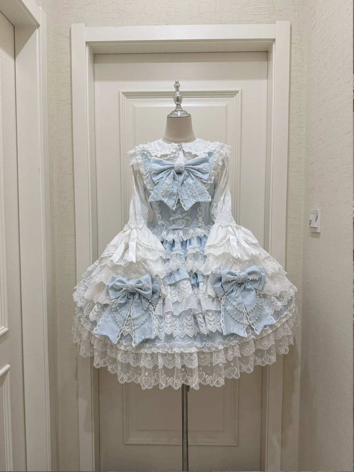 Lady Han Cross Heart Knot Sweet JSK dress featuring a charming bow and intricate details in soft pastel colors.