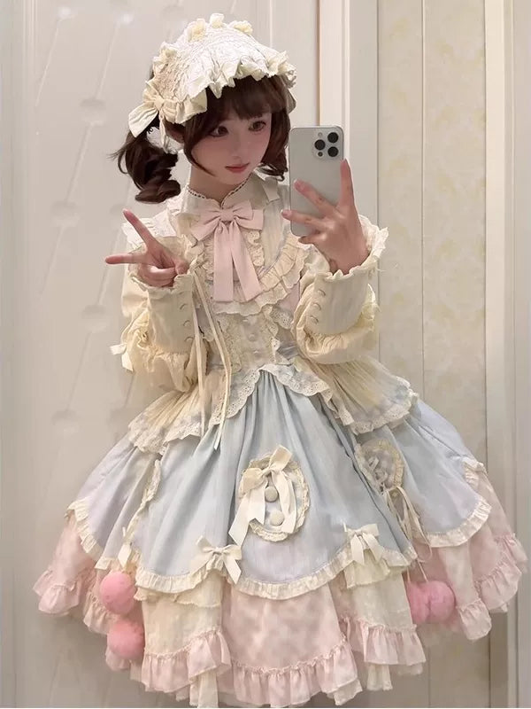 Creamy short blue and pink OP dress with layered ruffles and bows