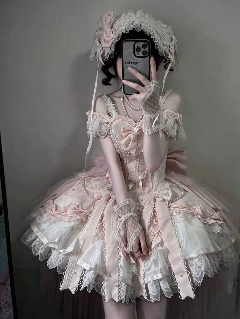Pale pink balletcore sweet lolita dress with off-shoulder bodice, lace trim, and tiered bell-shaped skirt