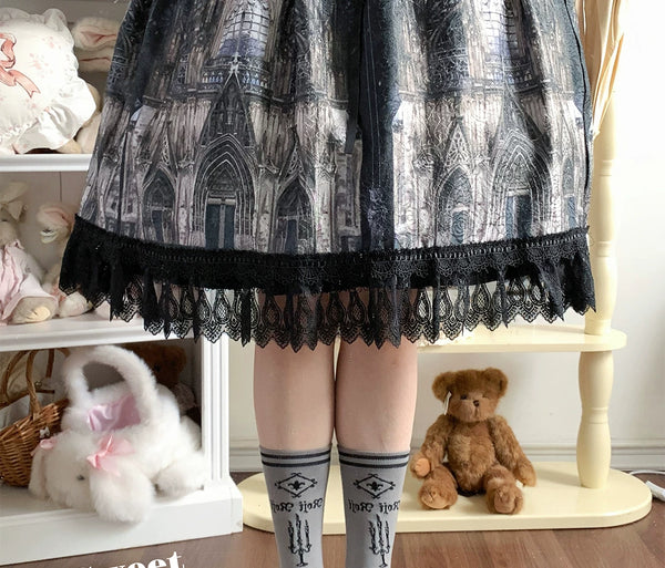 Multiple colourways of Magic Rabbit mid-calf socks with rabbit, key, candelabra and book motifs