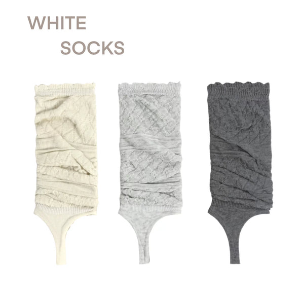 Milk white and gray diamond-knit stirrup socks shown flat-lay, with black socks styled on legs.