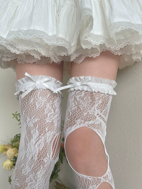 White openwork over-the-knee socks with ruffled tops, bow ties, and large leg cutouts.