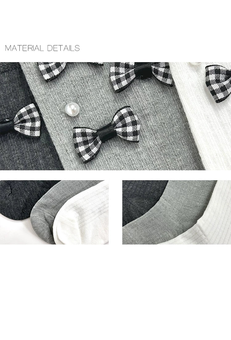 Grey mid-calf socks with plaid bows and button accents