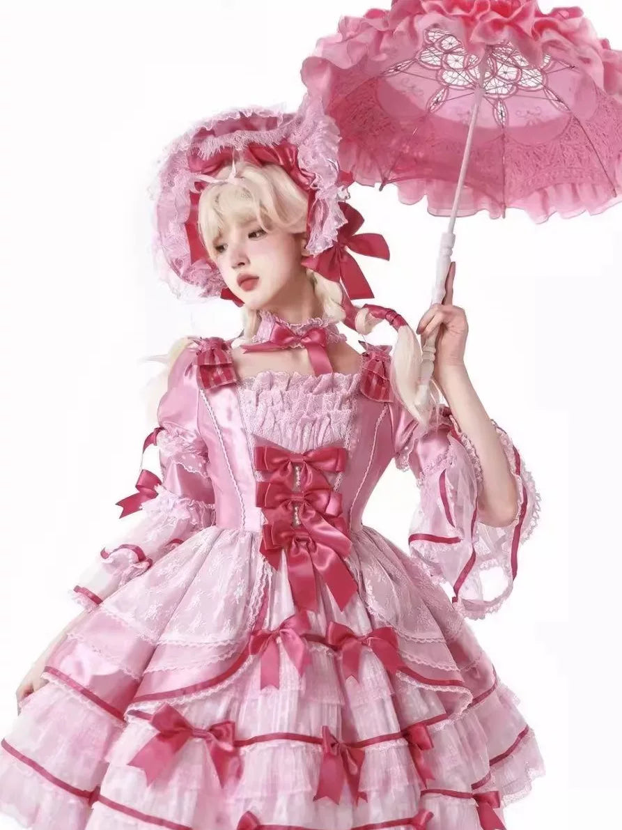 Pink doll-style OP dress with layered ruffles shown on a mannequin