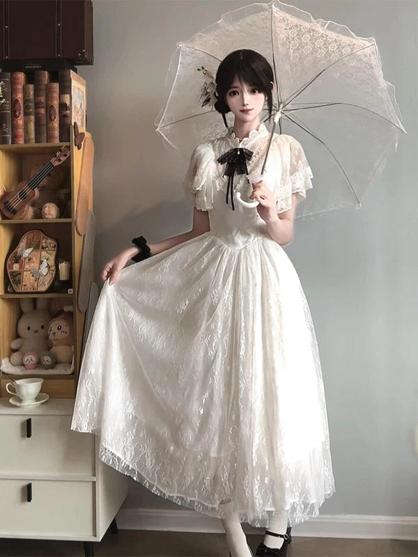 White lace-embroidered OP dress with a black neck bow