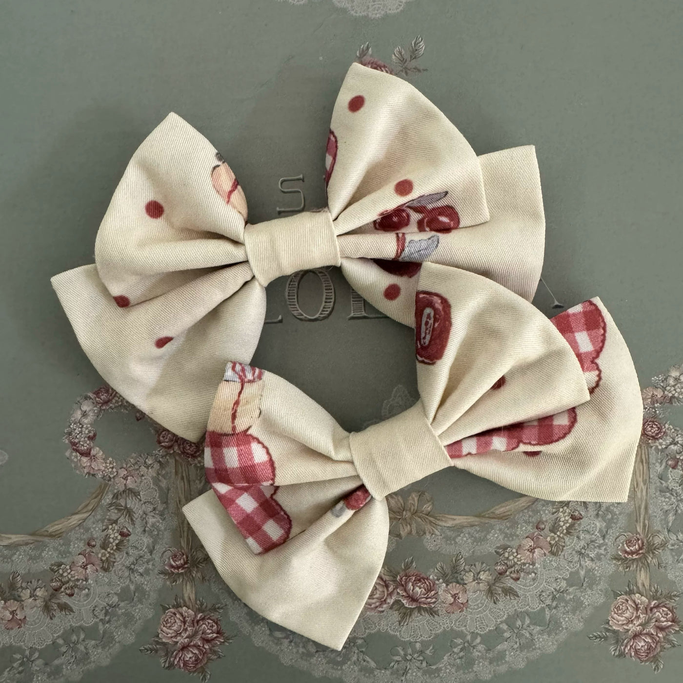 Cream cherry-and-Border Collie printed JSK shown with matching bow details in a promotional graphic.