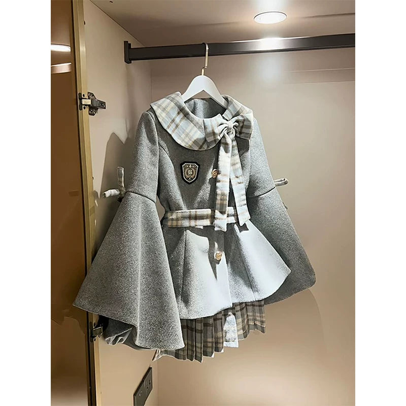 Gray plaid-collar coat and skirt set hanging from a wardrobe rail.