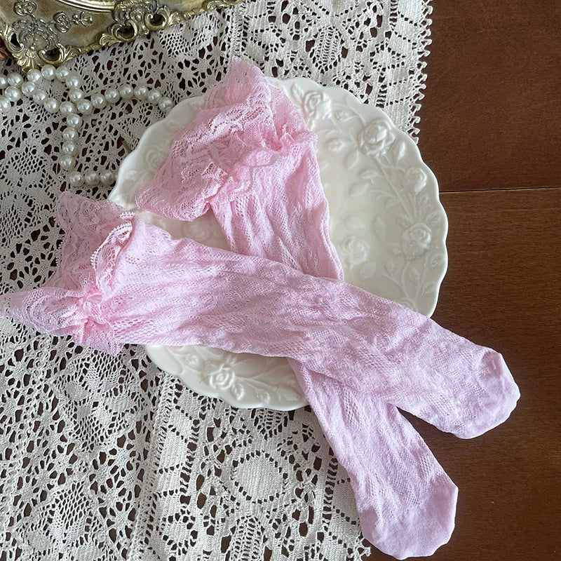 Pink lace stockings laid out on a white plate.