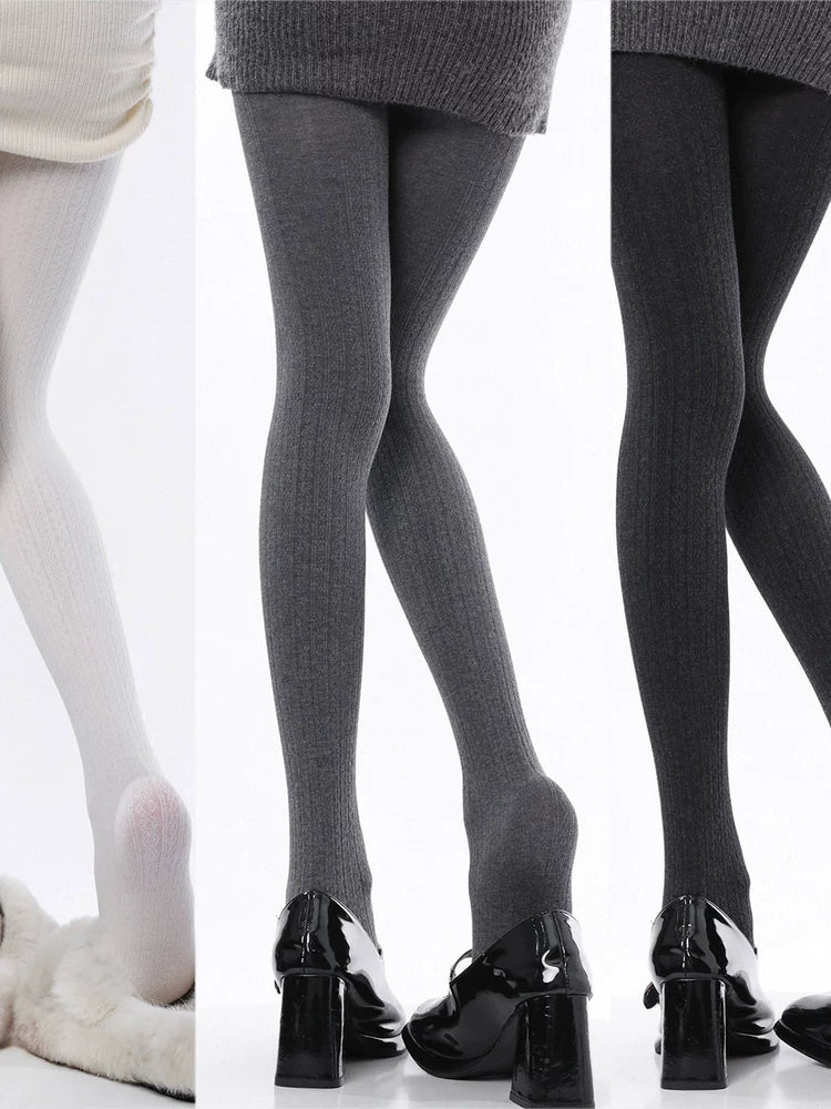 Off-white patterned tights shown beneath a cream knit skirt