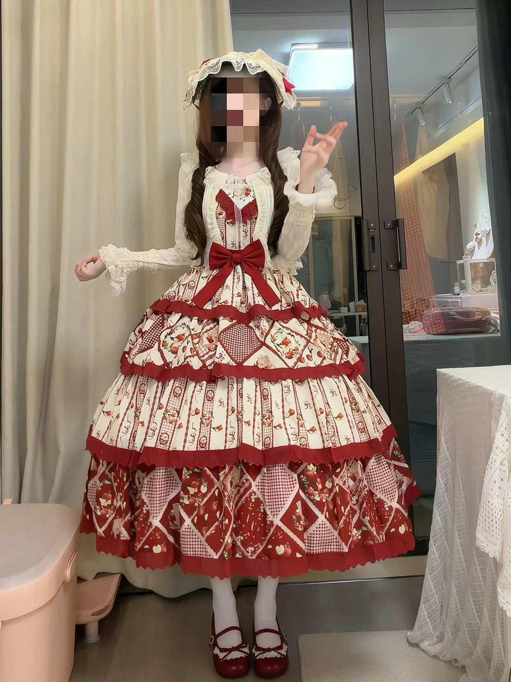 Red-and-apricot Creamy JSK dress set with patchwork fruit motifs, layered ruffles, a large bow, and a cardigan.