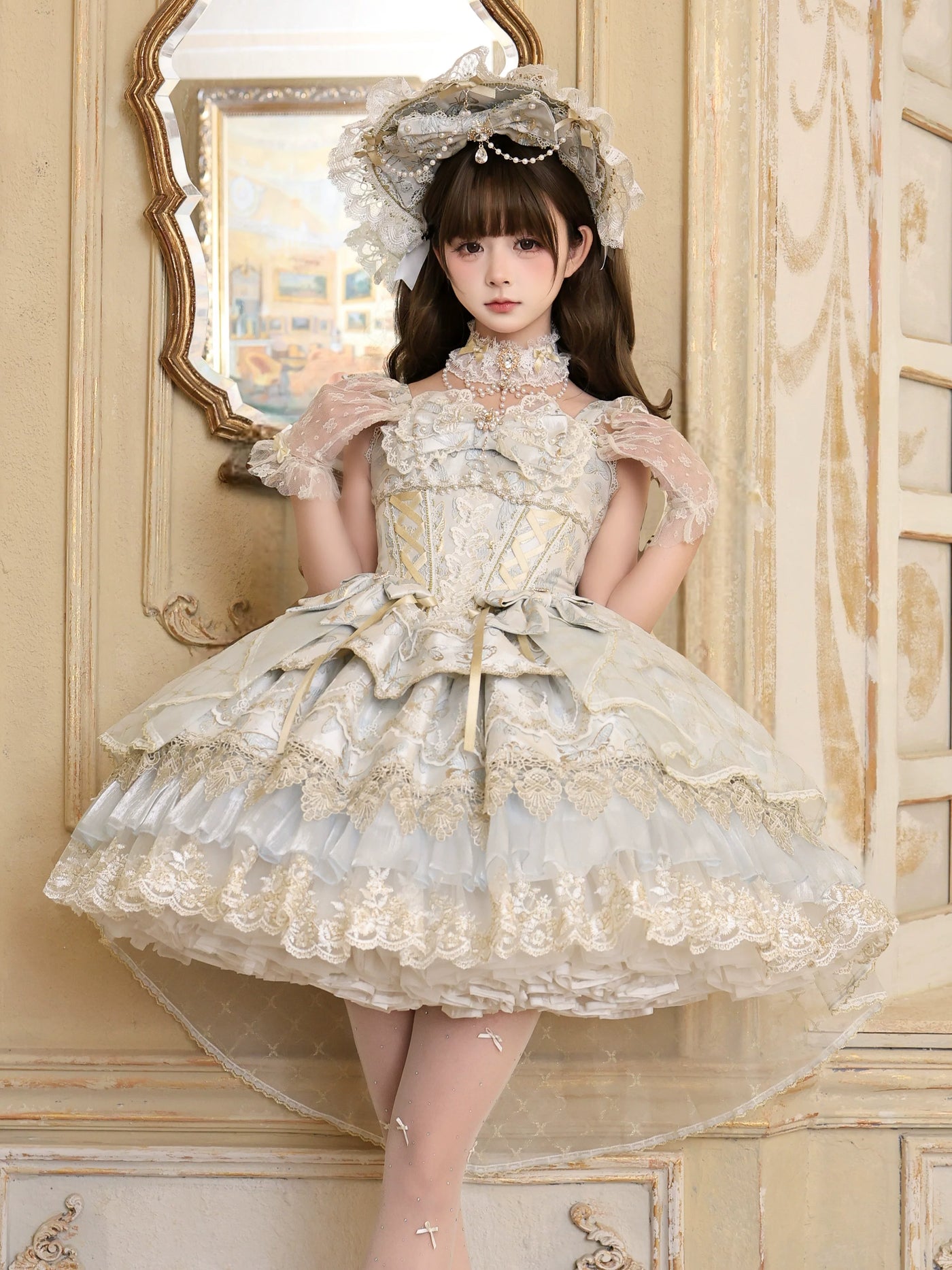 Pale blue Sweet Lolita JSK with gold lace trim and corset lacing, styled with lace bonnet and pearl accessories