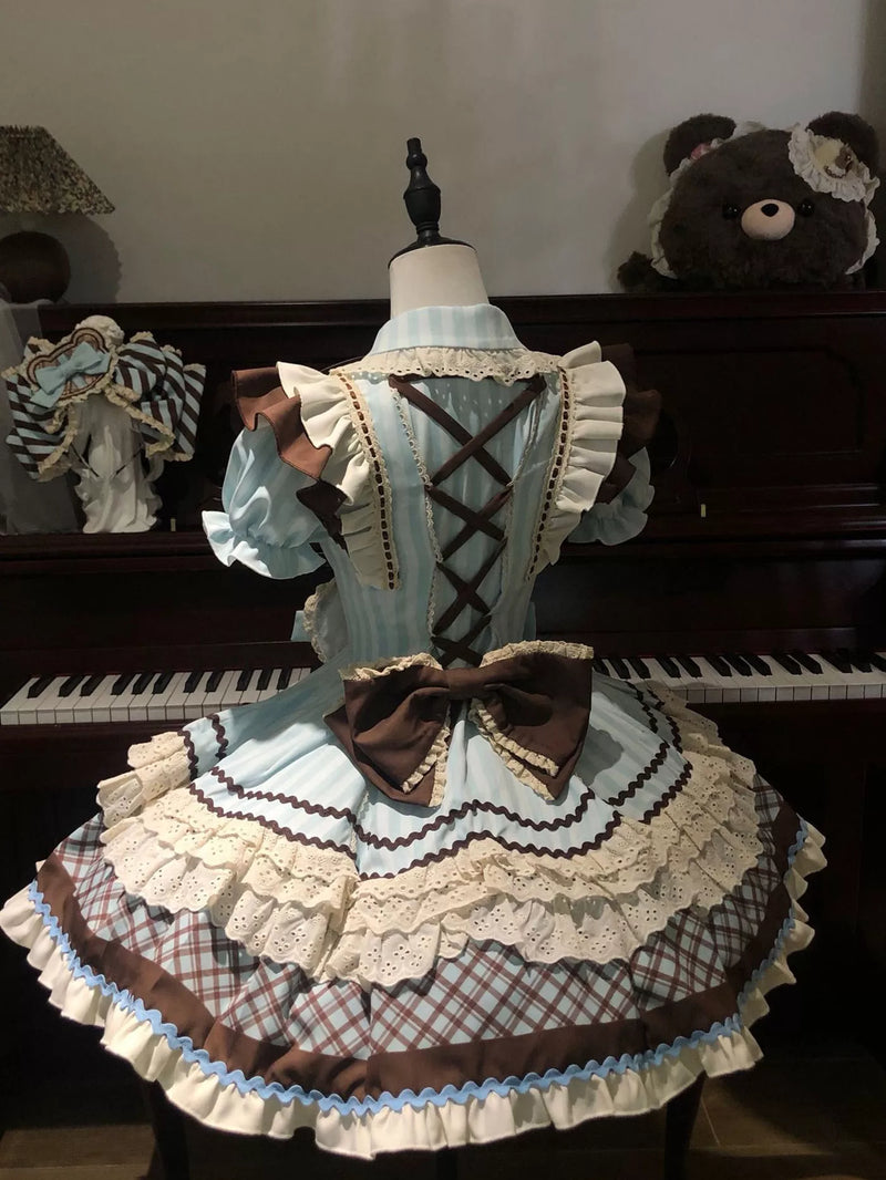 Back view of Sweet Lolita dress showing corset lacing and large rear brown bow
