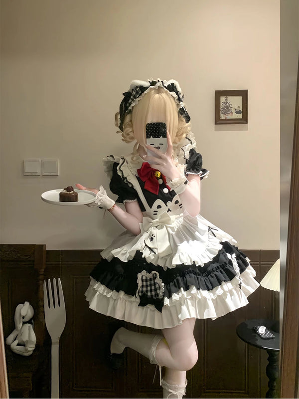 Black-and-white cat apron JSK dress worn in mirror styling photos