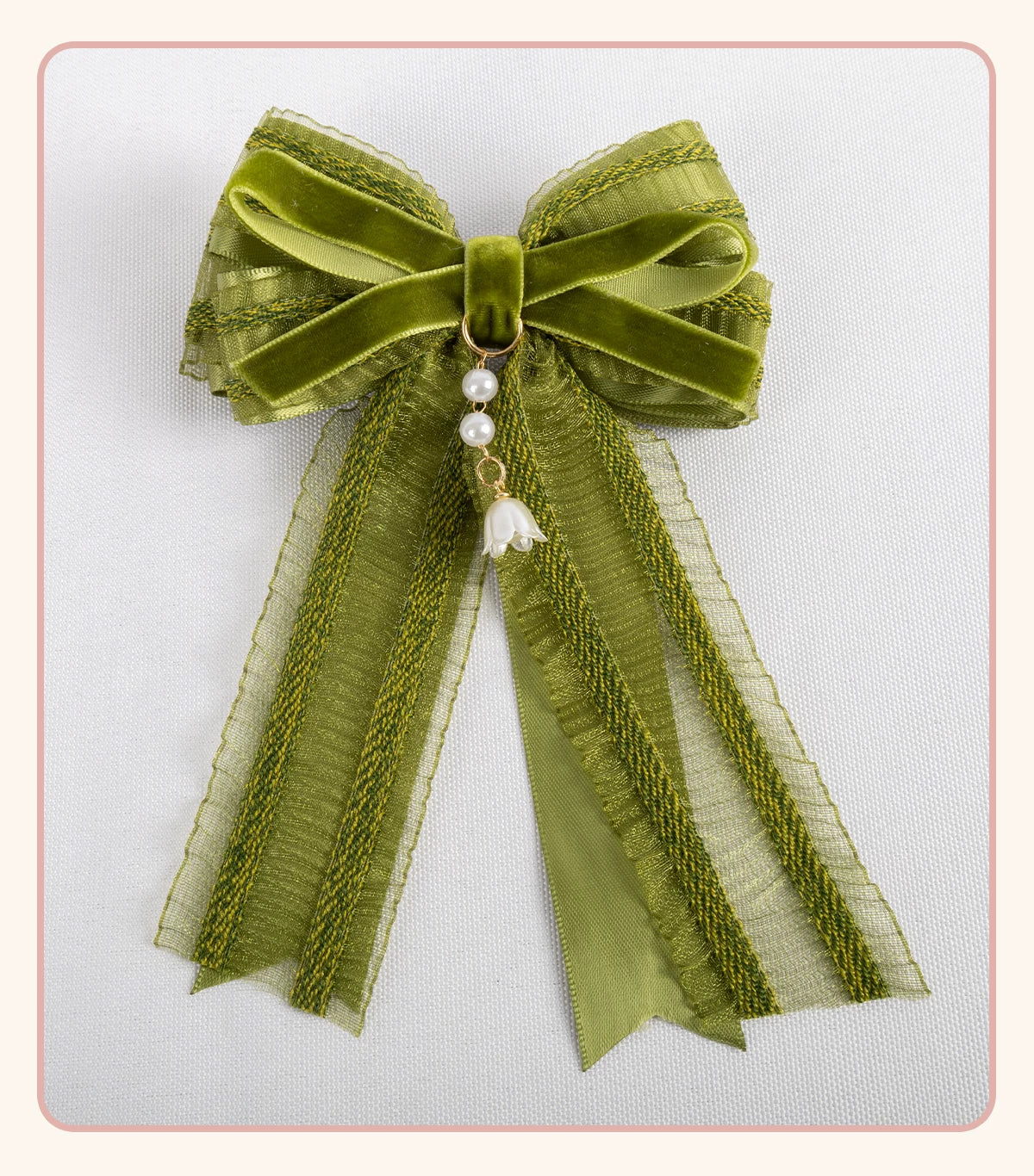 Stardust Rose green-and-white lace headwear with floral ribbons