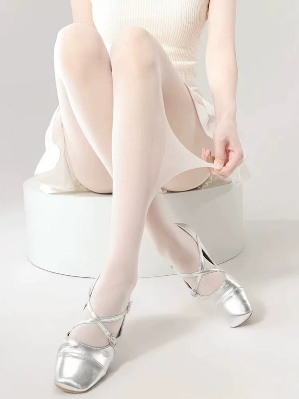 White pantyhose styled with silver shoes and pale ballet-inspired coordinates