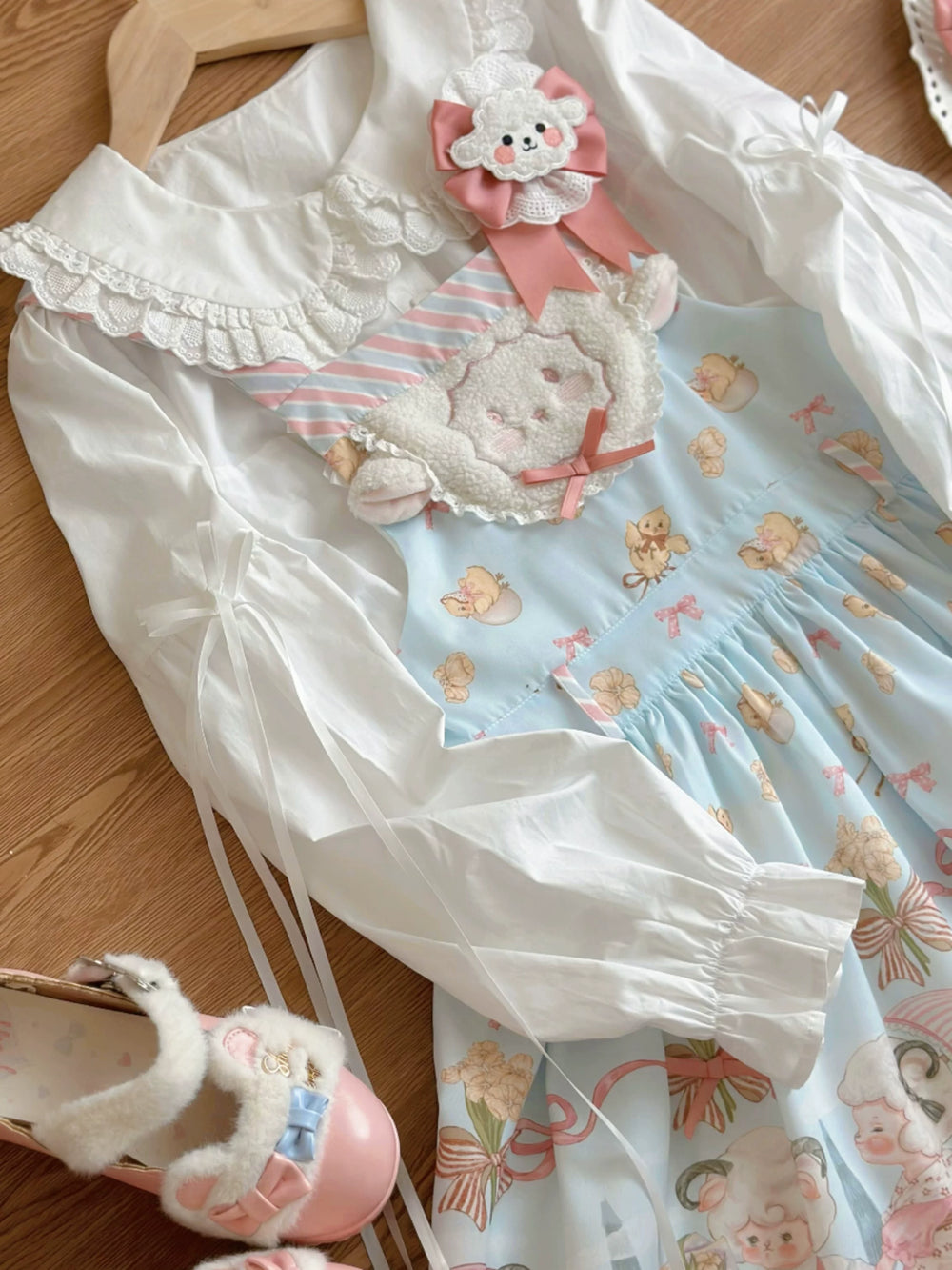 Cat Upon Cat ecru jumper skirt with a sheep appliqué and pale blue printed panel.