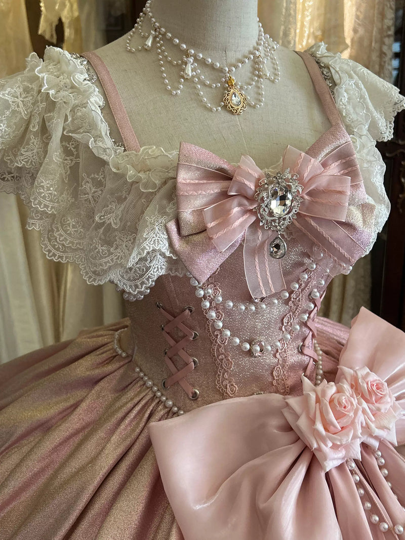 Voluminous pink lolita ball gown with layered skirt and scalloped pearl-trimmed hem