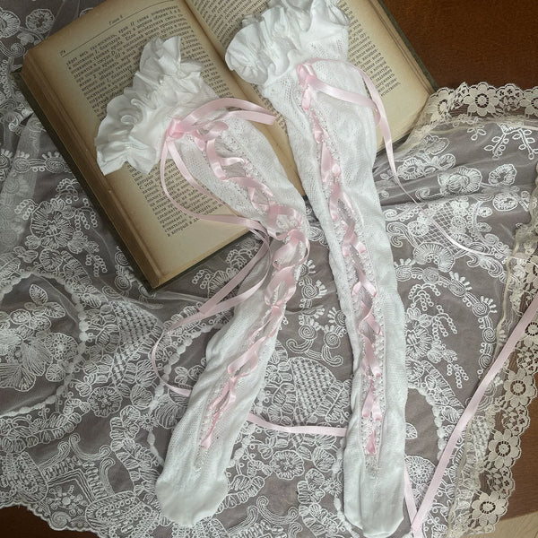 Pink-and-cream mid-calf lace stockings with ribbon lacing and a bow leg ring.
