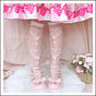 over knee socks / pink bow on white background