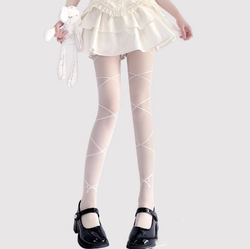 White over-the-knee socks with crossed bands and ankle bows shown on legs
