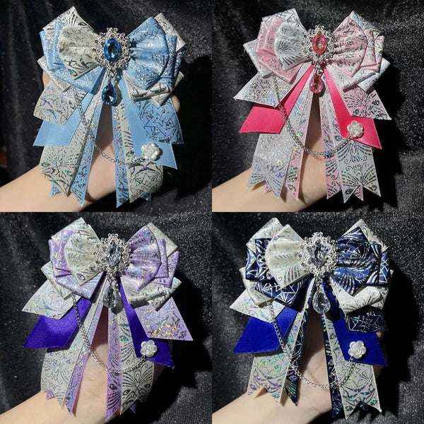 xxc230589 Royal Blue Snowflake Diamond Bow brooch with layered ribbons, chain and flower charm.