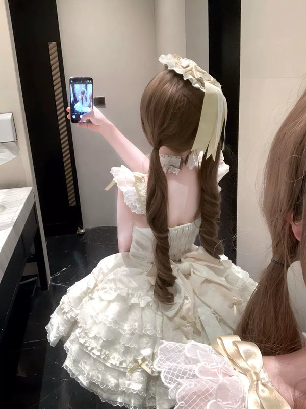 Creamy apricot Lolita dress with layered lace frills, bows, and a large train